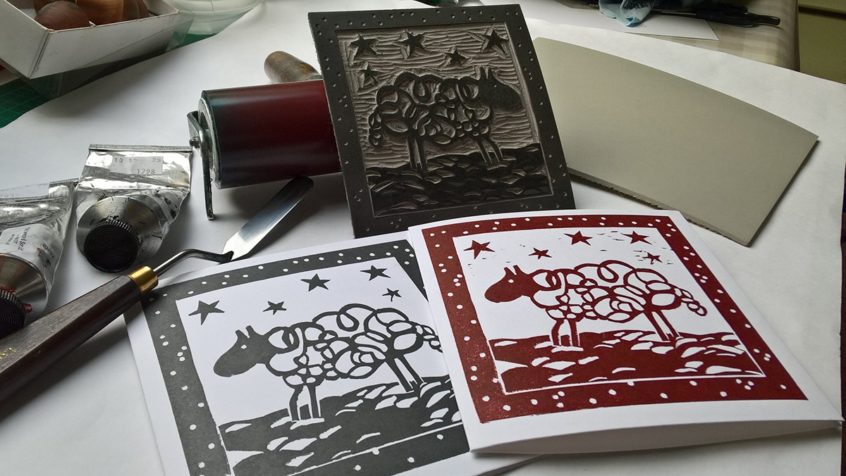 Anthea Bee lino printing Christmas cards.