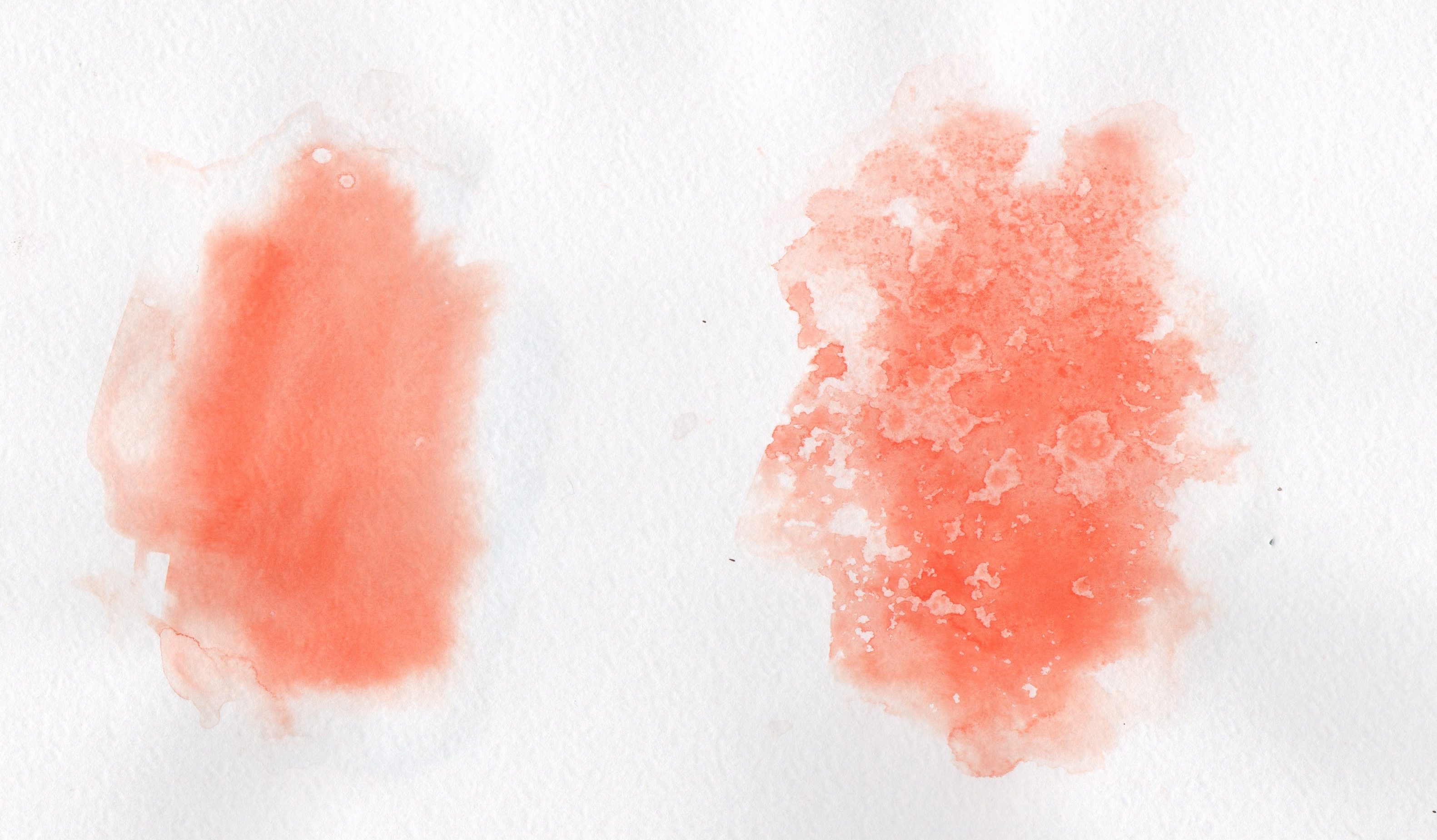 Right: Vermilion Light and Cadmium Orange Deep Schmincke Watercolour pure wash. Left: Vermilion Light and Cadmium Orange Deep Schmincke Watercolour wash with Schmincke Aqua Granulation spray applied
