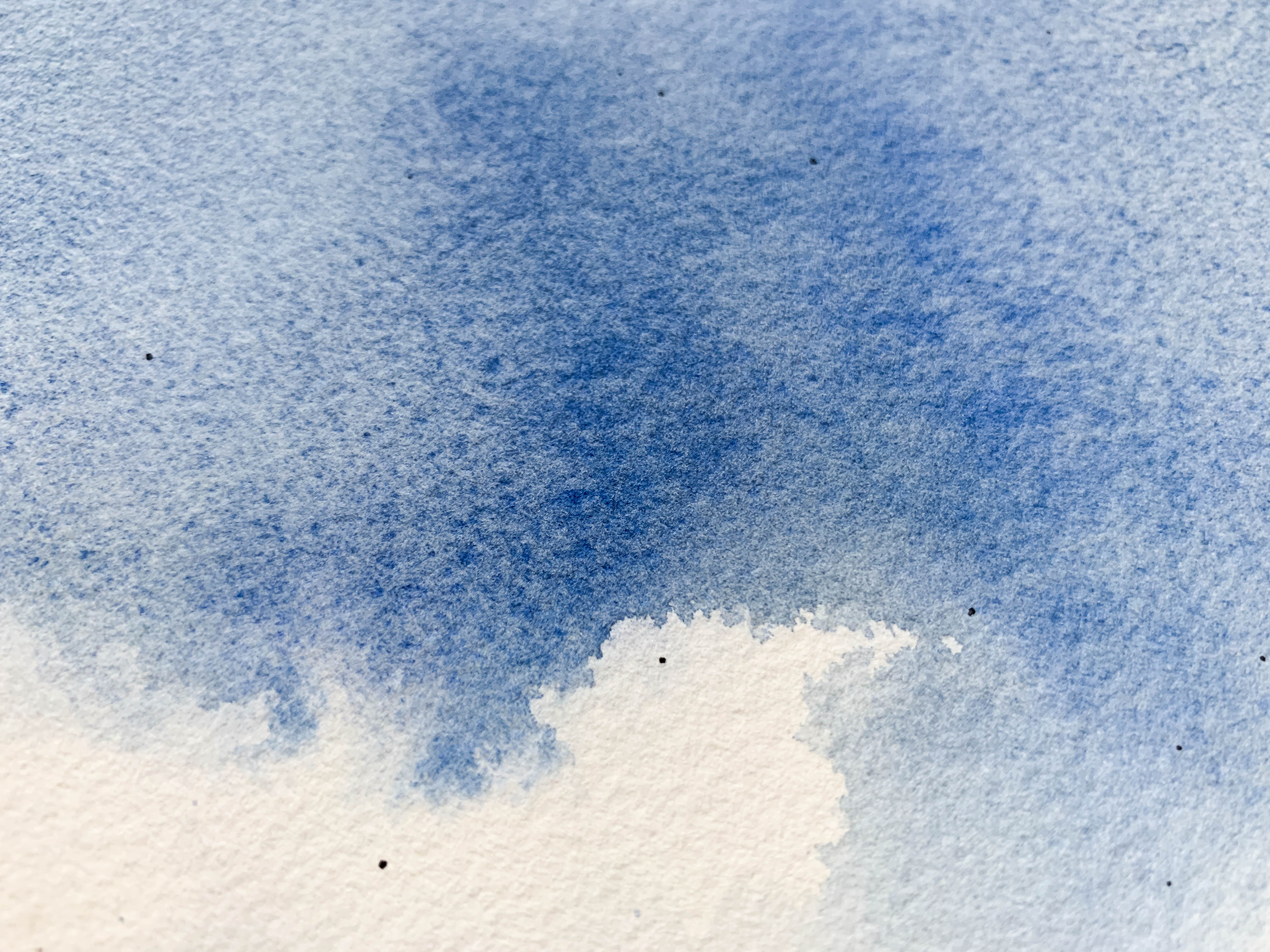 Granulation on watercolour paper demonstrating pigment sinking into the paper texture's dimples or 'holes'