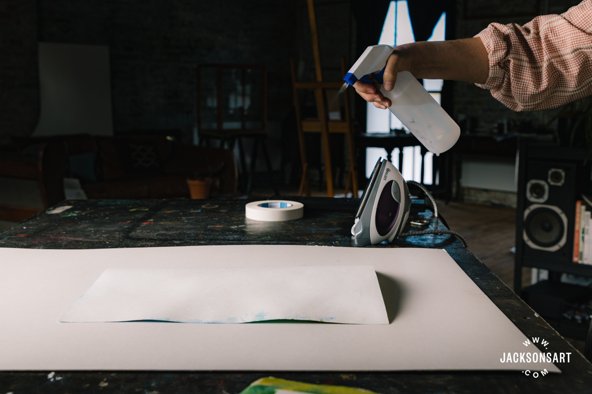 Ironing the paper flat