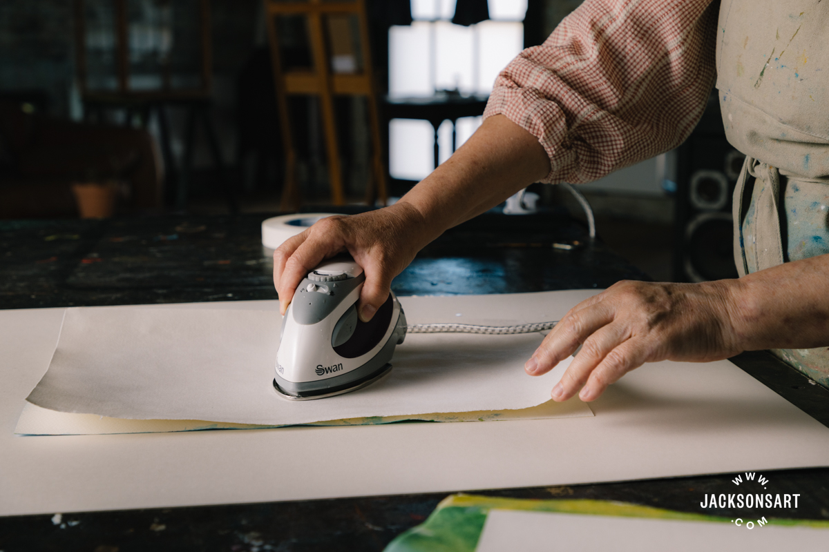 Ironing the paper flat