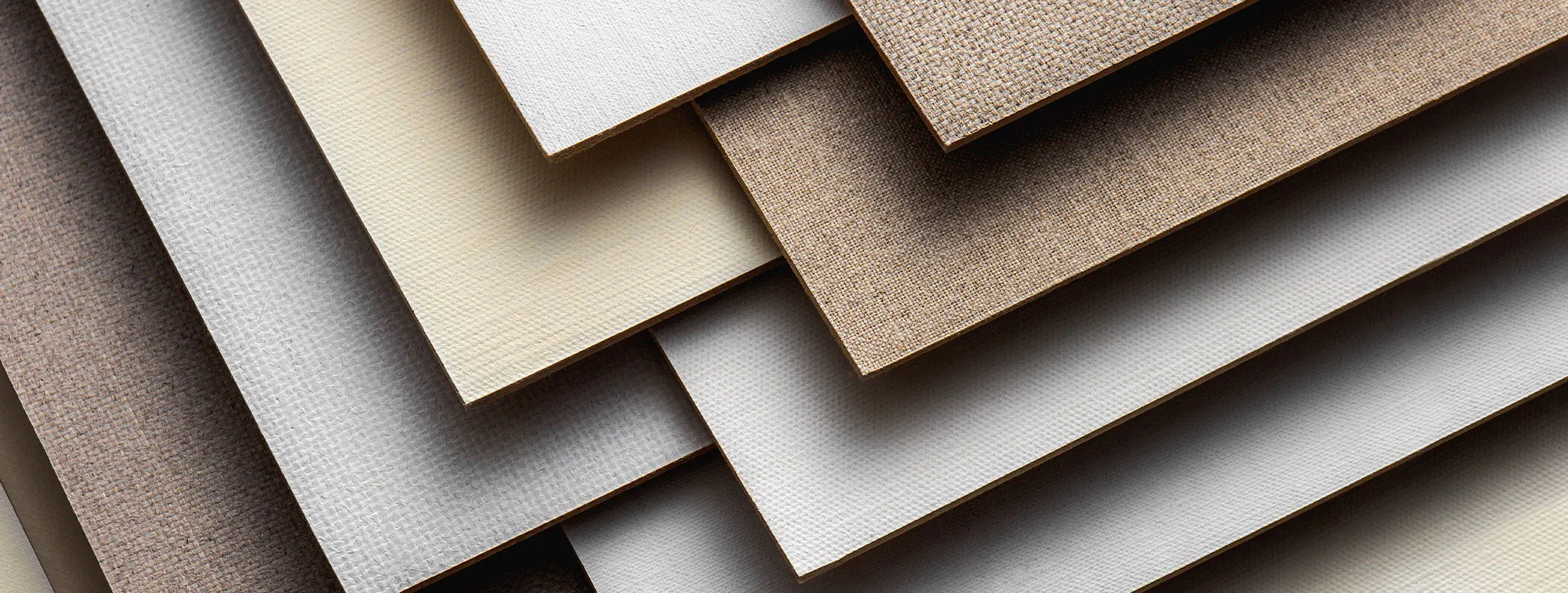 Canvas panels have canvas wrapped around the board and glued to the reverse, whereas boards have canvas glued to the front only.
