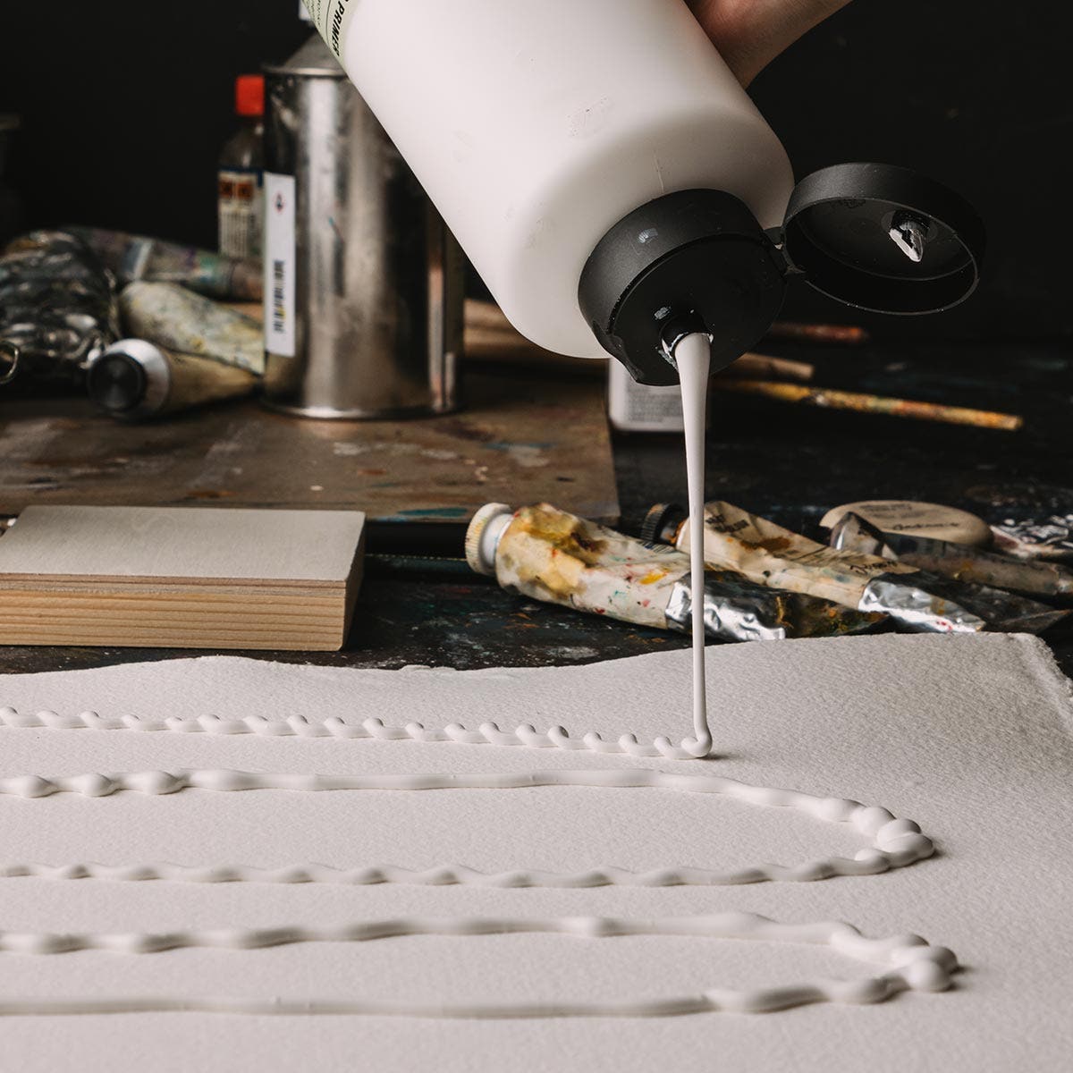 Jackson's Gesso Primer being squeezed out onto a canvas