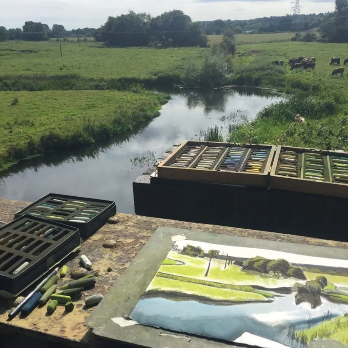 Sketching in front of a river
