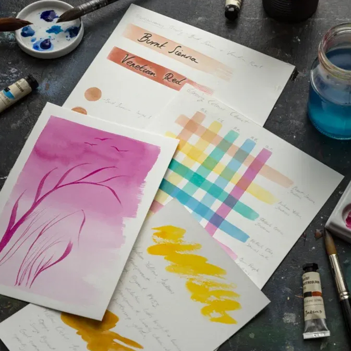 Watercolour glazing materials on a studio table