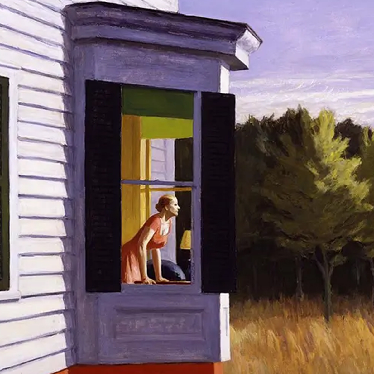 A woman in a pink dress leans out of a window in a white house with black shutters, observing the grassy landscape and trees under a partly cloudy sky.